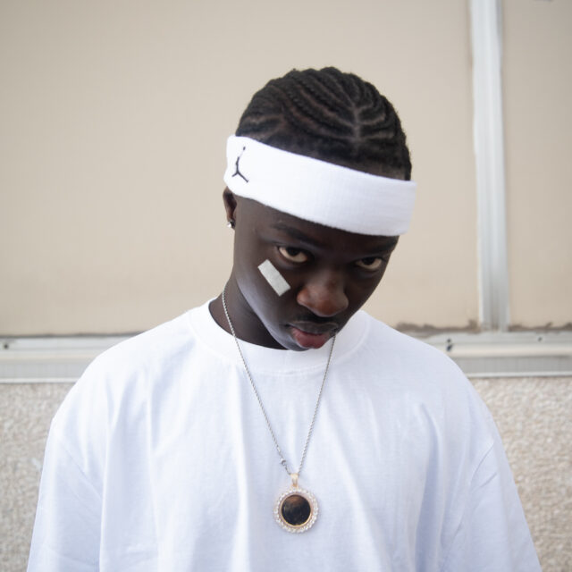Lil Gora's face portrait picture.